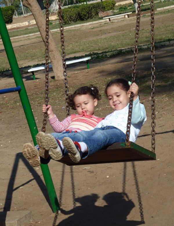 Sisters on the swings